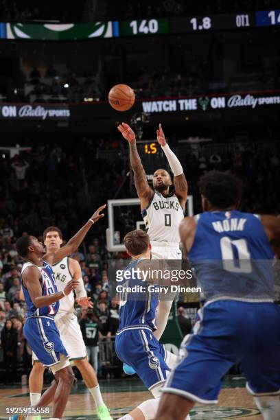 Damian Lillard of the Milwaukee Bucks shoots the game winning three point basket during the game against the Sacramento Kings on January 14, 2024 at...
