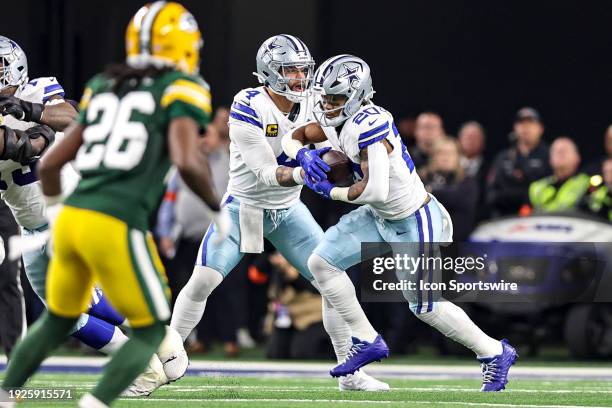 Dallas Cowboys quarterback Dak Prescott hands-off the football to running back Tony Pollard during the NFC Wild Card game between the Dallas Cowboys...