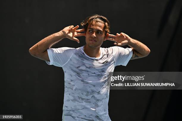 Italy's Flavio Cobolli celebrates after victory against Chile's Nicolas Jarry during their men's singles match on day two of the Australian Open...