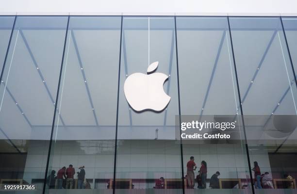 The Apple logo is seen at the Apple flagship store in Hangzhou, East China's Zhejiang province, Jan 15, 2024. On the same day, Apple's official...