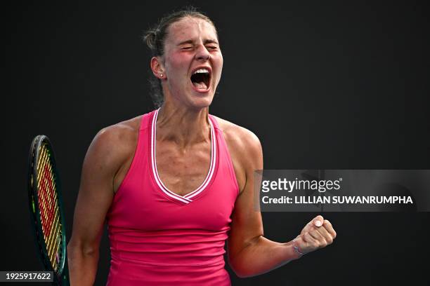 Ukraine's Marta Kostyuk celebrates after victory against USA's Claire Liu during their women's singles match on day two of the Australian Open tennis...