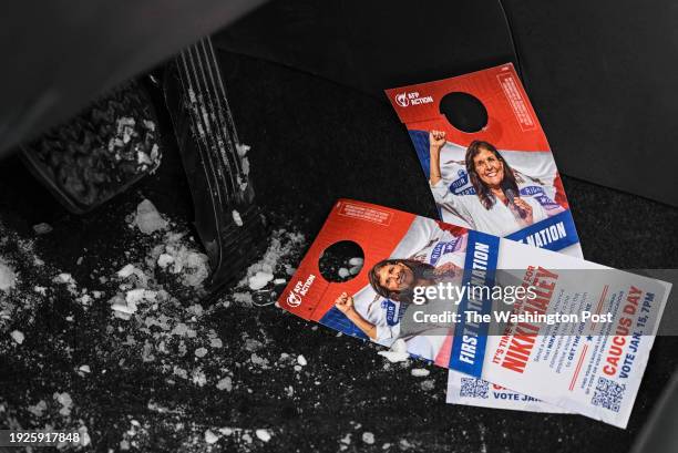 Nikki Haley campaign door hangers are seen on the driver side floor of an AFP Action member's car as they canvas a neighborhood to drum up support...