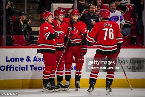 Andrei Svechnikov of the Carolina Hurricanes celebrates with teammates after a goal during the first period against the Anaheim Ducks at PNC Arena on...