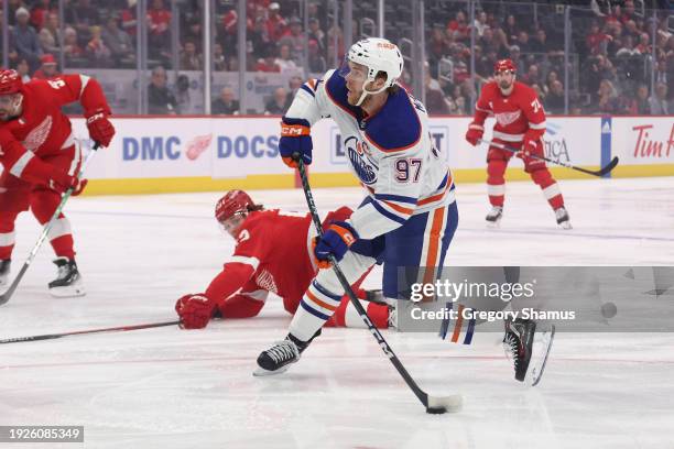 Connor McDavid of the Edmonton Oilers takes a first period shot against the Detroit Red Wings at Little Caesars Arena on January 11, 2024 in Detroit,...