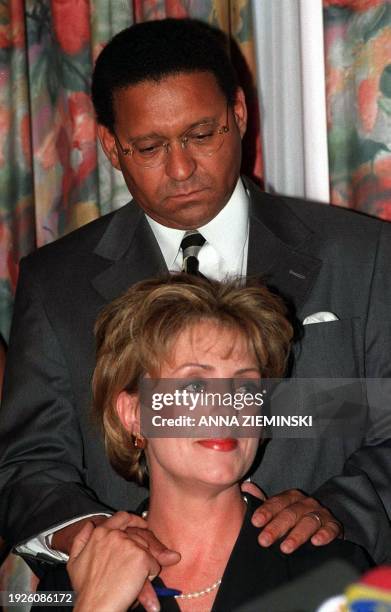 Allan Boesak, former head of the Foundation for Peace and Justice, and his wife Elna listen during a press conference held in Cape Town 14 May 2000...