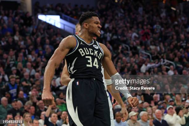 Giannis Antetokounmpo of the Milwaukee Bucks reacts to a score during the first half of a game against the Boston Celtics at Fiserv Forum on January...
