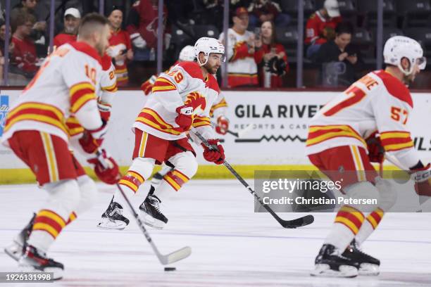 Dillon Dube of the Calgary Flames warms up before the NHL game against the Arizona Coyotes at Mullett Arena on January 11, 2024 in Tempe, Arizona.