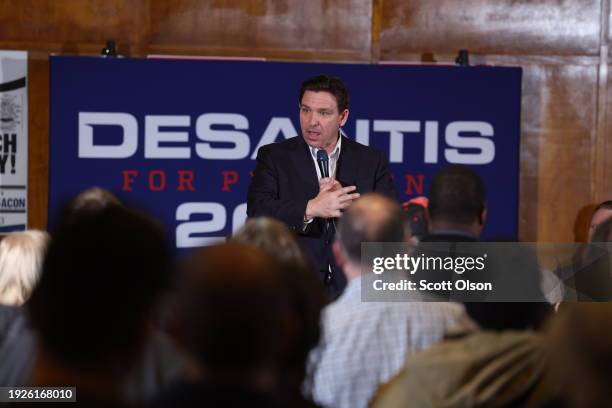 Republican presidential candidate Florida Governor Ron DeSantis speaks to guests during a campaign rally at Jethro's BBQ on January 11, 2024 in Ames,...