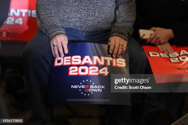 Supporters of Republican presidential candidate Florida Governor Ron DeSantis attend a campaign event at Jethro's BBQ on January 11, 2024 in Ames,...