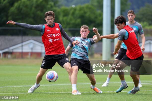 Alex Rufer tackles Matt Sheridan during a Wellington Phoenix A-League training session at NZCIS on January 12, 2024 in Wellington, New Zealand.