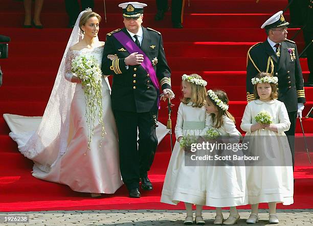 Prince Laurent of Belgium and his bride Claire Coombs leave the Cathedral of St. Michael and St. Gudula April 12, 2003 after their marriage ceremony...