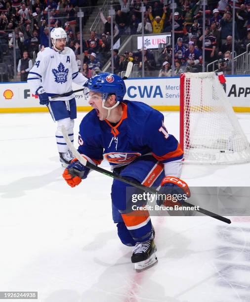Mathew Barzal of the New York Islanders scores the game-winning goal at 21 seconds of overtime against the Toronto Maple Leafs at UBS Arena on...