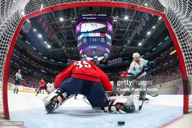 Adam Larsson of the Seattle Kraken scores a goal on goalie Darcy Kuemper of the Washington Capitals during the third period at Capital One Arena on...