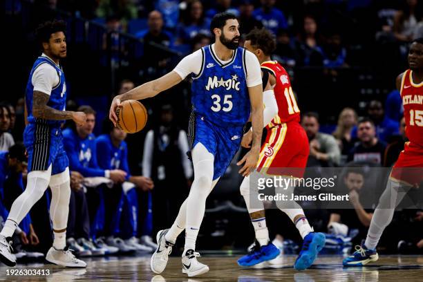 Goga Bitadze of the Orlando Magic dribbles the ball during the first half of a game against the Atlanta Hawks at the Kia Center on January 07, 2024...