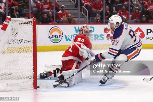Connor McDavid of the Edmonton Oilers scores a third period goal past Alex Lyon of the Detroit Red Wings at Little Caesars Arena on January 11, 2024...