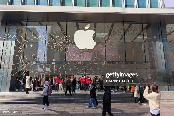 Customers experience the iPhone15 series at Apple's flagship store in Shanghai, China, Jan 15, 2024. On the same day, Apple's official website in...