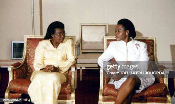 Benin's First lady Marguerite Kerekou speaks with her Gabonese counterpart Edith Lucie Bongo in the VIP lounge 16 May 2001 at Libreville...