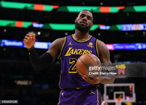 LeBron James of the Los Angeles Lakers reacts to a Lakers foul during the first half against the Phoenix Suns at Crypto.com Arena on January 11, 2024...