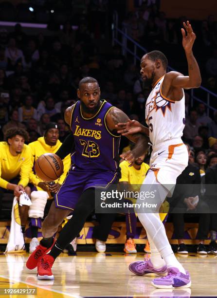 LeBron James of the Los Angeles Lakers drives to the basket on Kevin Durant of the Phoenix Suns during the first half at Crypto.com Arena on January...
