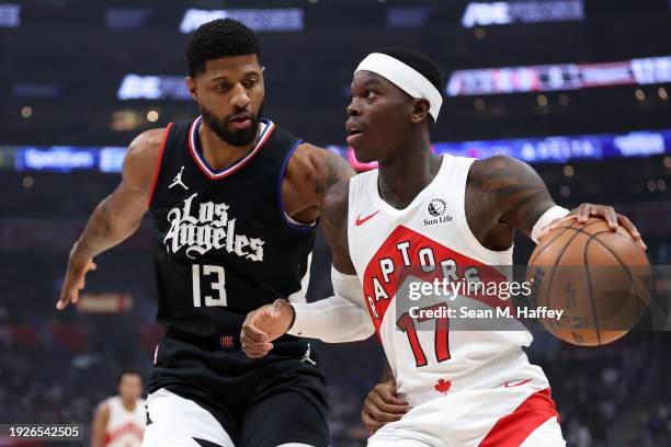 Paul George of the LA Clippers defends against Dennis Schroder of the Toronto Raptors during the first half of a game at Crypto.com Arena on January...