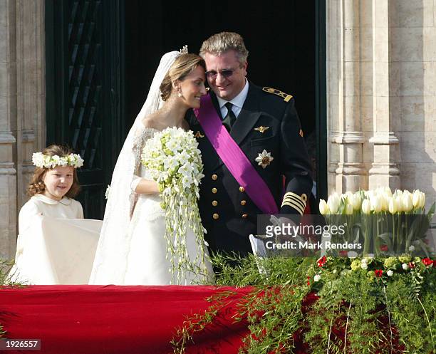 Prince Laurent of Belgium and his bride Claire Coombs wave to the crowd from the balcony of Brussels townhall April 12, 2003 in Brussels, Belgium....