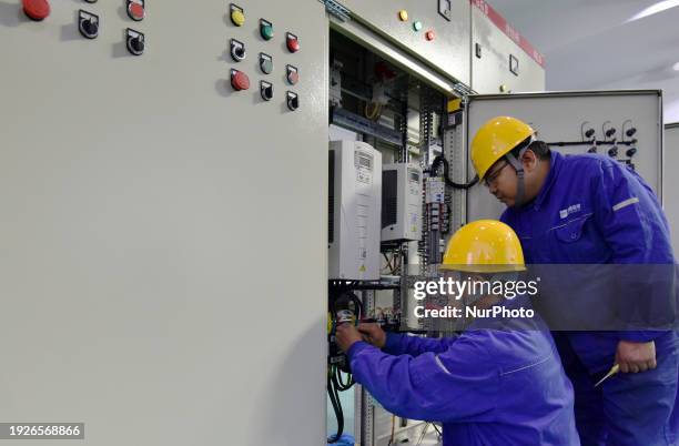 Industrial technicians are installing and debugging a big data system at an enterprise in Zhangjiakou, Hebei Province, China, on January 15, 2024.