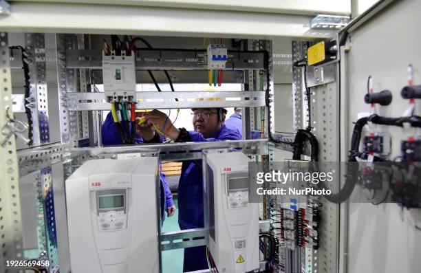 Industrial technicians are installing and debugging a big data system at an enterprise in Zhangjiakou, Hebei Province, China, on January 15, 2024.