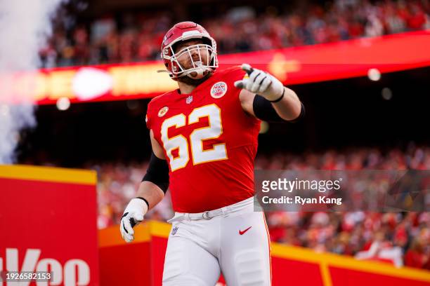 Joe Thuney of the Kansas City Chiefs runs onto the field during player introductions before an NFL football game against the Buffalo Bills at GEHA...
