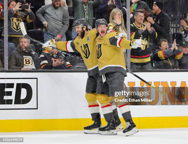 Alex Pietrangelo and Jack Eichel of the Vegas Golden Knights celebrate Pietrangelo's overtime goal against the Boston Bruins during their game at...