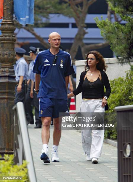 French defender Frank Leboeuf and his wife Betty arrive 01 June 2002 at the Sheraton Hotel in Seoul for a lunch with the French squad. Holders France...