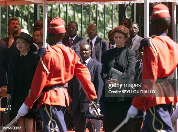 Colette Senghor , the widow of Leopold Sedar Senghor, and Viviane Wade , wife of Senegalese President Abdoulaye Wade, watch Senegalese Red Guards...