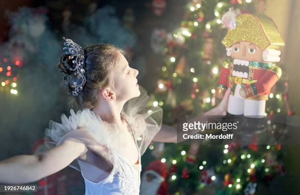 beautiful preteen girl ballet dancer is holding the nutcracker on her hands - ballet dancers russia stockfoto's en -beelden