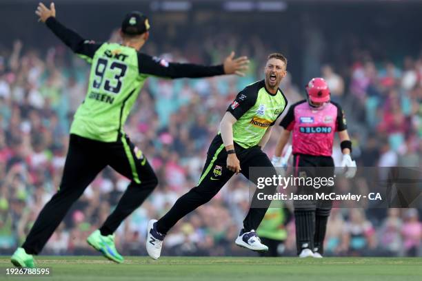 Daniel Sams of the Thunder celebrates after taking the wicket of Steve Smith of the Sixers during the BBL match between Sydney Sixers and Sydney...