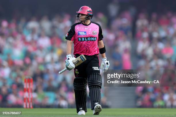 Steve Smith of the Sixers walks off the field after been dismissed by Daniel Sams of the Thunder during the BBL match between Sydney Sixers and...