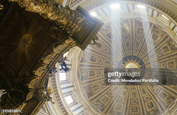 St. Peter's Baldachin, a large Baroque sculpted bronze canopy over the high altar of St. Peter's Basilica, designed by the Italian artist Gian...