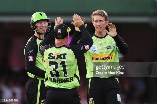 Toby Gray of the Thunder celebrates with team mates after taking the wicket of James Vince of the Sixers during the BBL match between Sydney Sixers...