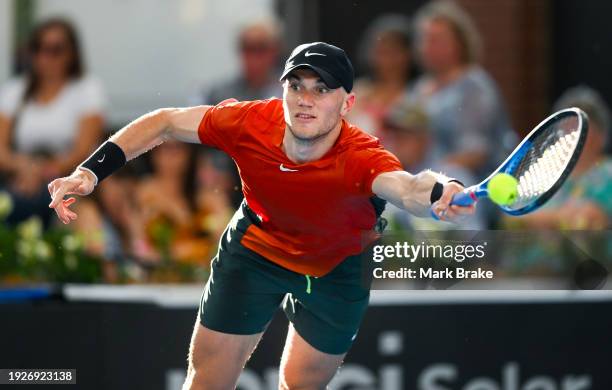 Jack Draper of Great Britain stretches to return serve in his match against Alexander Bublik of Kazakhstan during day five of the 2024 Adelaide...