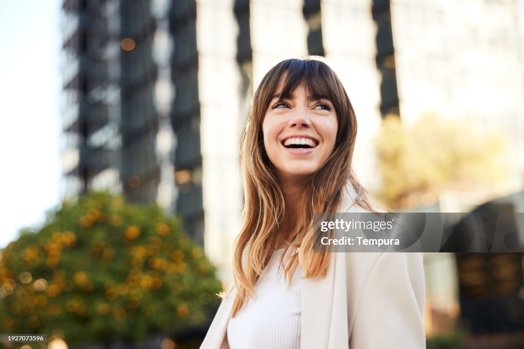 Afternoon Commuting: Young Professional Walks, Looking Back with a Broad Smile.