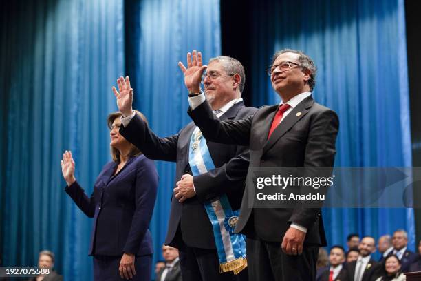 Guatemala's new President Bernardo Arevalo and new Vice-President Karin Herrera and Colombia's President Gustavo Petro wave during inauguration...