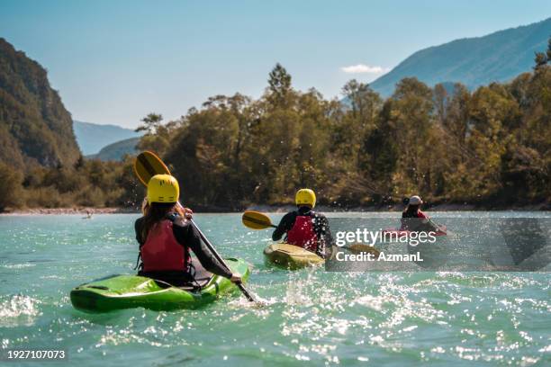 group kayak outing in nature's splendor - white water kayaking stock pictures, royalty-free photos & images