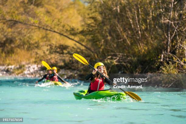 multiethnic kayakers exploring mountain river - slovenia soca stock pictures, royalty-free photos & images