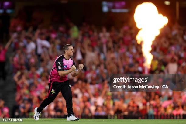 Steve O'Keefe of the Sixers celebrates after taking the wicket of David Warner of the Thunder during the BBL match between Sydney Sixers and Sydney...