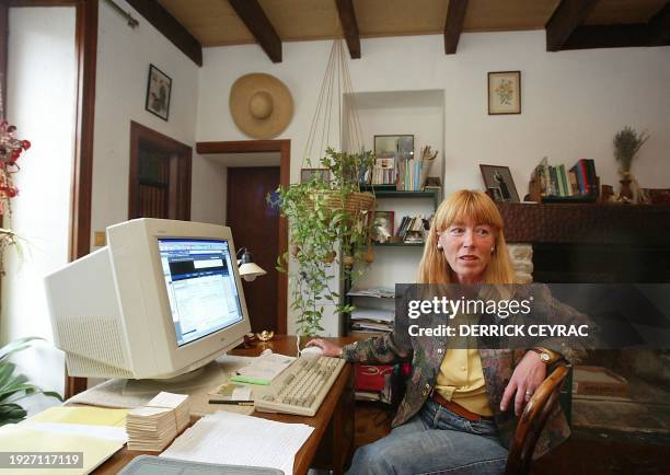 Picture dated 11 October 2002 shows Annika Einhorn, wife of accused murderer US Ira Einhorn, posing in the office of the home she shared with Einhorn...