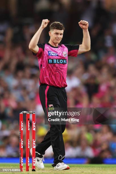 Hayden Kerr of the Sixers celebrates victory after taking the wicket of Liam Hatcher of the Thunder during the BBL match between Sydney Sixers and...