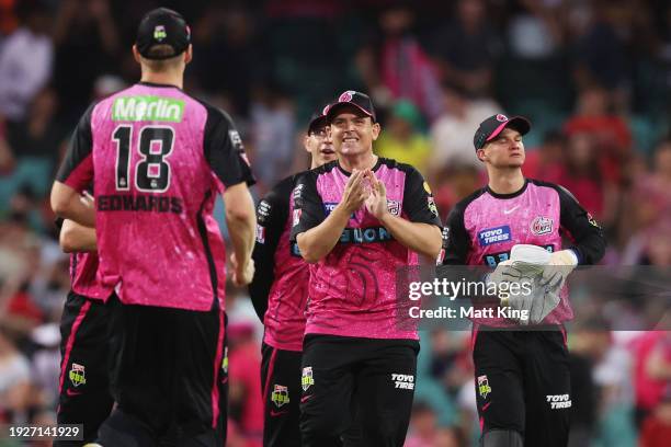 Stephen O’Keefe of the Sixers celebrates victory with team mates after the BBL match between Sydney Sixers and Sydney Thunder at Sydney Cricket...