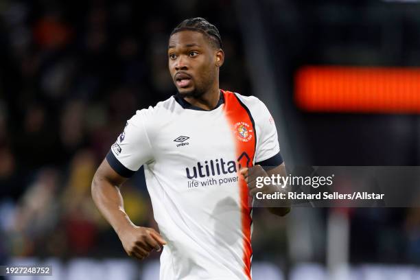 Teden Mengi of Luton Town running during the Premier League match between Burnley FC and Luton Town at Turf Moor on January 12, 2024 in Burnley,...