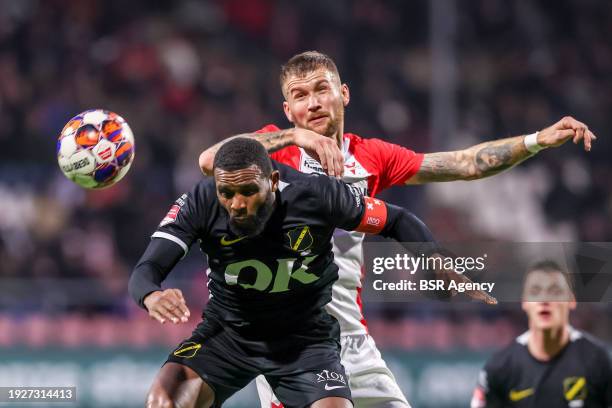 Cuco Martina of NAC Breda competes for the headed ball with Piotr Parzyszek of FC Emmen during the Dutch Keuken Kampioen Divisie match between FC...