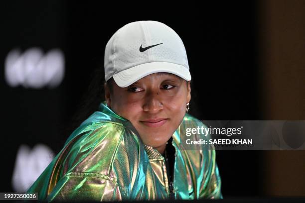 Japan's Naomi Osaka takes part in a press conference after losing her women's singles match on day two of the Australian Open tennis tournament in...