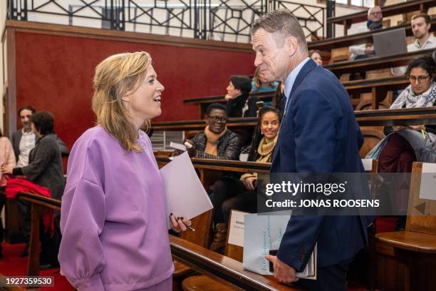 Belgium's Interior Minister Annelies Verlinden speaks with Minister of Justice Paul Van Tigchelt at the start of a press conference to launch the...