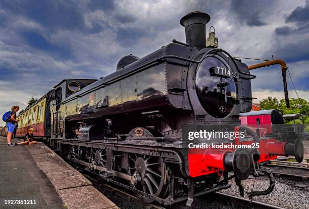 the severn valley steam and diesel heritage railway at kidderminster station shropshire. england uk. it is a warm sunny day. - history and progress of the steam engine stock pictures, royalty-free photos & images